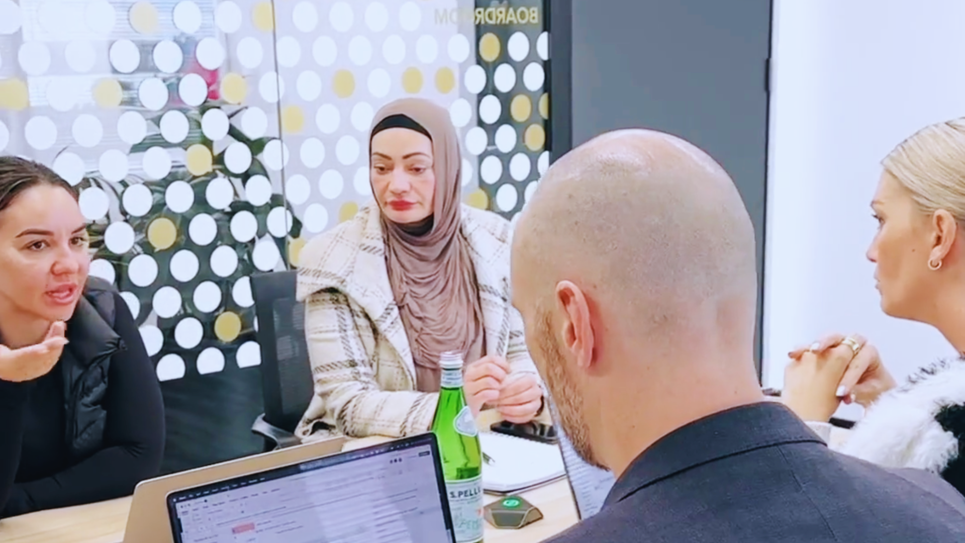 Two female businesswomen discussing franchise strategies in a meeting.